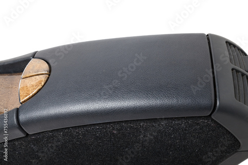 Plastic element of car interior is covered in black leather - armrest or a glove compartment - spare part with air conditioning holes on a white background. Catalog for site. photo