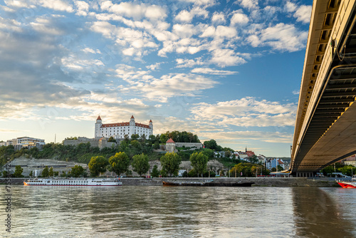 Photography View of the Danube River in Bratislava with the Bratislava Castle and the SNP Bridge