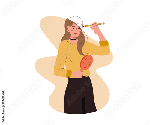 Woman draws own image with pencil and holds mirror in hands as metaphor for working to improve personality. Psychological concept of substituting one personality to another for deceive others.
