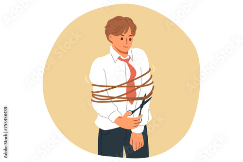Successful business man freed himself from ropes limit movements and prevent from achieving success. Guy manager is freed from shackles hinder professional growth and career advancement