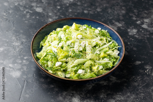 Maroulosalata Greek Lettuce Salad with with iceberg lettuce, herbs, feta cheese.