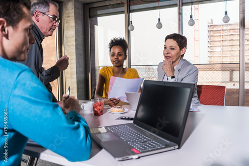 Colleagues planning business strategy in meeting room