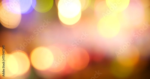 Vibrant Bokeh abstract blurred background music festival stage show performance party. Colorful bokeh background spark animate motion. Backdrop display with twinkling nightlife shape blinking light