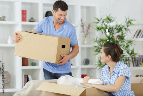 man and woman with boxes