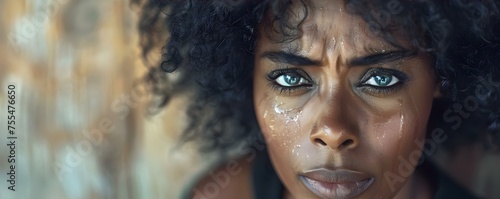 Expressing Deep Emotion: Black Woman's Tearful Moment. Concept Depicting Sadness, Emotional Portraits, Tears of Grief, Black Women's Emotions photo