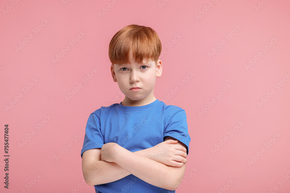 Portrait of sad little boy on pink background Portrait of sad little boy on pink background