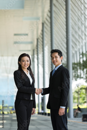 Chinese Business people shaking hands