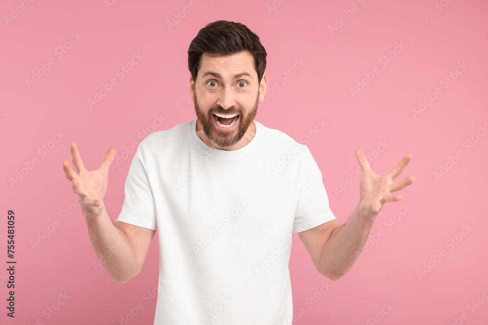 Portrait of surprised man on pink background Portrait of surprised man on pink background