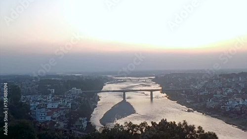 Full view of a city alogn with river in evening photo