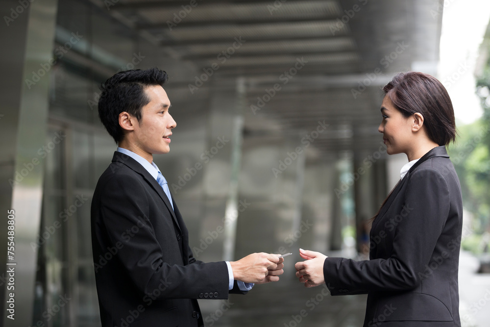 Asian Businessman presenting his business card Asian Businessman presenting his business card