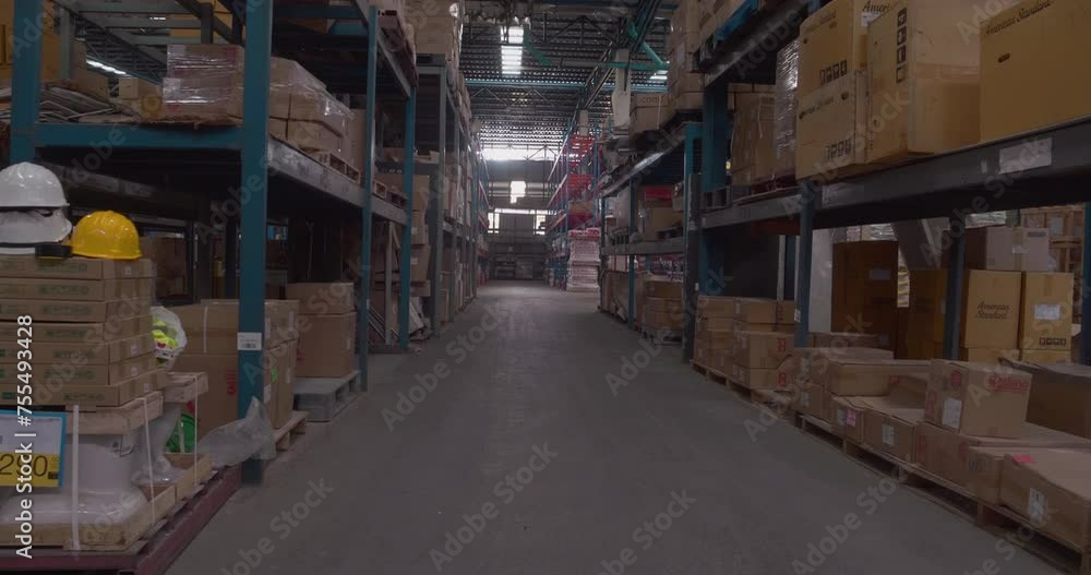 Blurred Background Commercial packaging on steel rack. Aisle in storehouse inventory. Warehouse background storage inventory shelf with freight container aisle space. Blur supply lot shelf cardboard Blurred Background Commercial packaging on steel rack. Aisle in storehouse inventory. Warehouse background storage inventory shelf with freight container aisle space. Blur supply lot shelf cardboard
