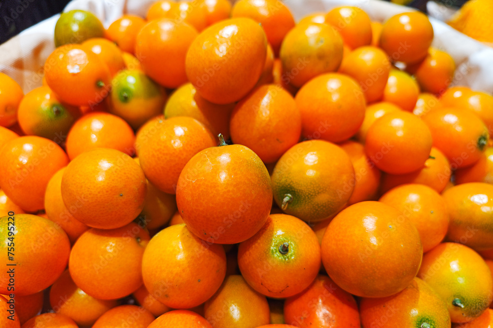 Lots of little cumquat or kumquat background. Lots of little cumquat or kumquat background.