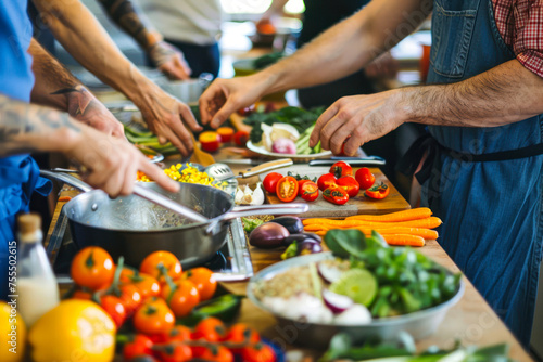 Group of people actively participating in a cooking workshop with a variety of vegetables