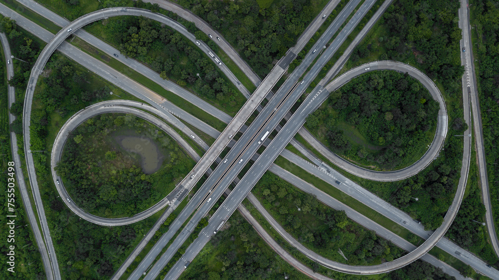 Aerial view of highway and overpass, Junctions of city highway vehicles drive on roads, Aerial view highway interchange.