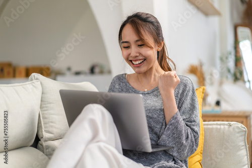 Young smiling asian woman happy relax use laptop conference work,learning, education, shopping, study online, webinar, online marketing, business, blog, digital internet advertising at home