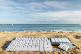 computer keyboard on a beach