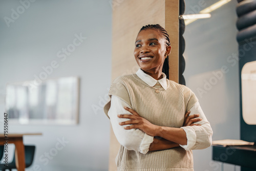 Young African female entrepreneur looking pensive in a corporate office photo