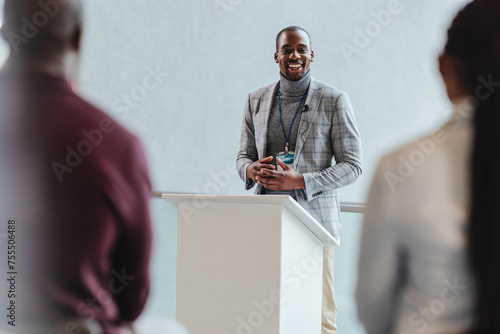 Confident businessman giving a presentation at a corporate meeting