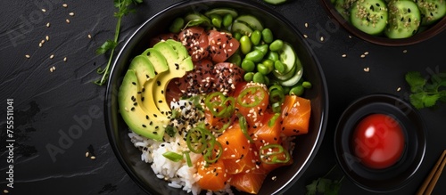 A colorful bowl filled with a variety of ingredients, including rice, meat, and vegetables, presenting a healthy and balanced Hawaiian diet dish. The bowl features poke bowl fish, avocado, sesame