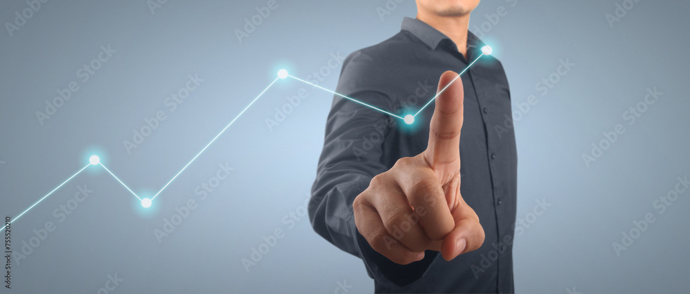Businessman plan graph growth and increase of chart positive indicators in his business Businessman plan graph growth and increase of chart positive indicators in his business