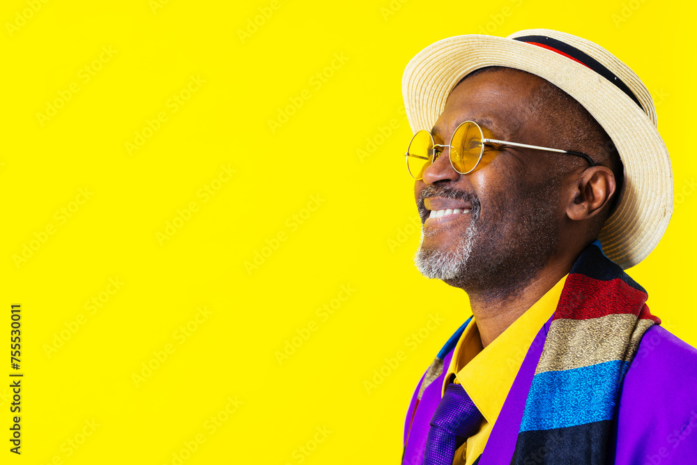 Cool senior black man with fashionable outfit portrait - African old person wearing cool stylish clothing on colorful background Cool senior black man with fashionable outfit portrait - African old person wearing cool stylish clothing on colorful background