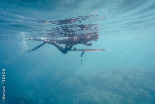 Man spearfishing in wetsuit, Mediterranean. High quality photo © Olivier