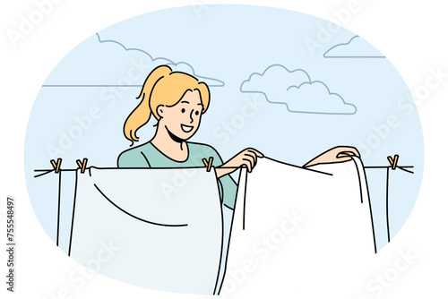 Smiling woman hanging fresh clothes on wire to dry outdoors. Happy housewife drying clothing on washing line. Household and chores. Vector illustration.