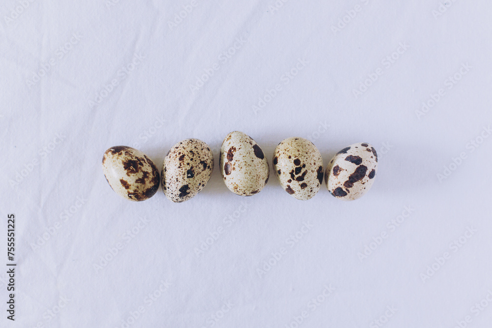 Quail eggs on a white background. Minimal concept. Flat lay.