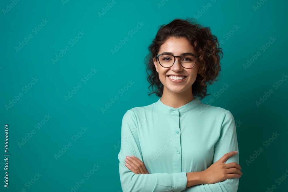 A girl of European appearance with glasses. smiling. On a blue background with space for text. A girl of European appearance with glasses. smiling. On a blue background with space for text.