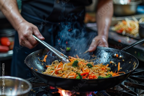 black Close up of an intimate kitchen setting captures hands skillfully preparing fresh broccoli, with a hint of a person in the background enjoying a glass of wine. Fresh ingredients and the joys of 