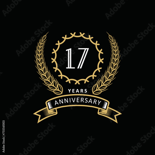 17st anniversary logo with gold and white frame and color. on black background photo