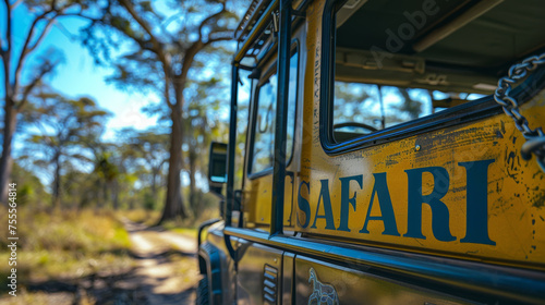 Safari car in savannah landscape with word Safari written on the car , safari travel in Africa concept image
