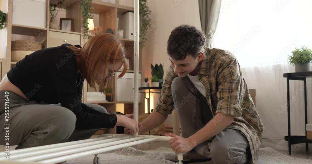 man and woman couple or brother sister Put Together Assembly Furniture man and woman couple or brother sister Put Together Assembly Furniture