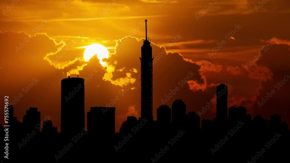 Cairo Modern downtown and Tower in Silhouette, Time Lapse at Sunset with Red Sun and Fiery Sky, Egypt Cairo Modern downtown and Tower in Silhouette, Time Lapse at Sunset with Red Sun and Fiery Sky, Egypt