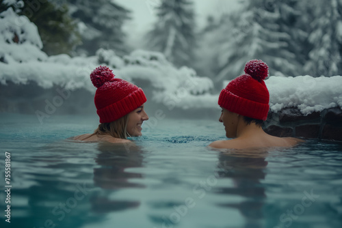 Beautiful couple man and woman in red hats swim in thermal spring bathes in water with steam, in winter. Snowy forest around. AI Generative