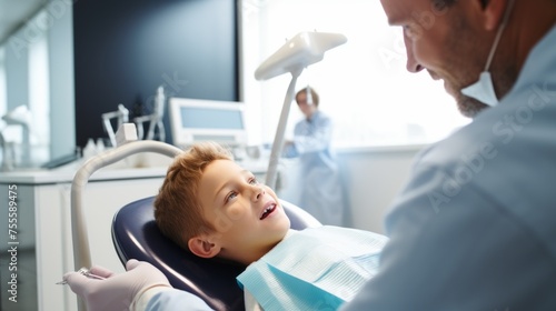 A little boy, patient in a chair at a pediatric dental clinic. Dentist, orthodontist, Dental cleaning, Caries treatment, pulpitis, periodontitis, stomatitis, Healthcare, Oral hygiene, teeth check-up.