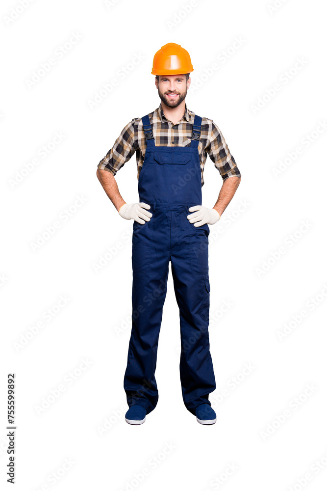 Full size fullbody portrait of joyful attractive repairer in shirt and overall, holding his arms on waist, looking at camera, isolated on grey background Full size fullbody portrait of joyful attractive repairer in shirt and overall, holding his arms on waist, looking at camera, isolated on grey background