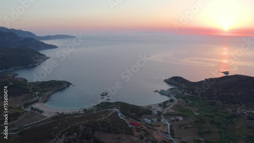 4K aerial - a bird's eye view video (Ultra High Definition) of Cheromylos beach. Unbelievable summer sunrise on Euboea island, Greece. Majestic Aegean seascape. Beauty of nature concept background. photo