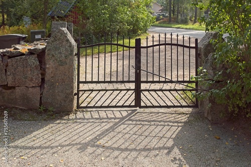View of traditional old wrought iron gate of a cemetery, Finland.