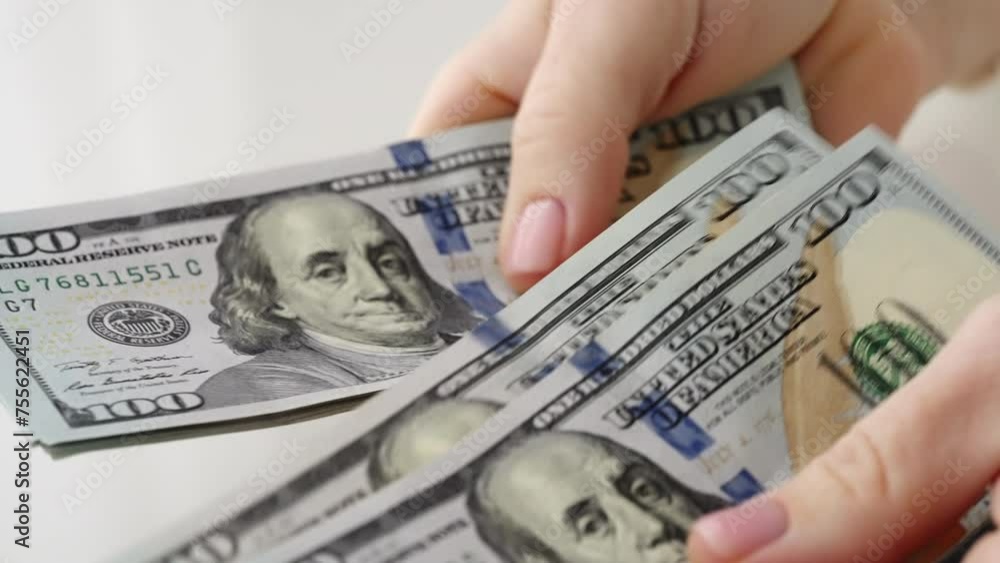 Hands counting one hundred dollar bills in office. Stack of hundred dollar bills. Banknotes in hands close-up. World economy. Currency exchange. Cash payment. Businessman counts dollar bills. Finance
