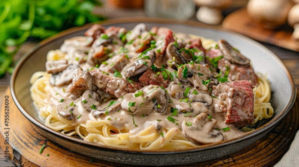 Creamy Beef Stroganoff with Mushrooms and Parsley on Spaghetti Pasta - Gourmet Meal on Wooden Table Creamy Beef Stroganoff with Mushrooms and Parsley on Spaghetti Pasta - Gourmet Meal on Wooden Table
