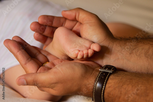 New born baby feet on the hands of a happy dad  © Beto Santillan