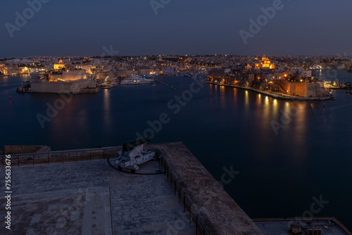 Panoramic view at dusk of the bay that separates Valletta from the three cities, Malta photo