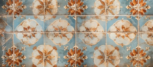 This close-up view showcases a tiled wall adorned with intricate floral patterns. The vintage ceramic tiles featuring flowers create a textured and aged look, ideal for interior design projects. The