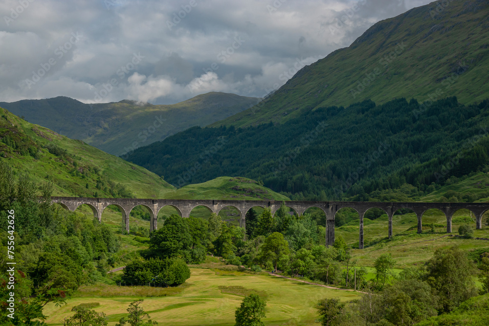 Dramatic mountain scenery of Scottish Highlands with famous Glenfinnan Viaduct