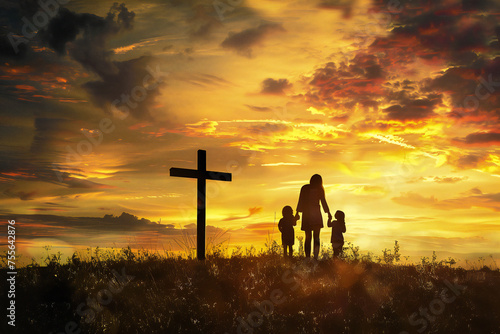 Silhouette of a family in search of a cross at sunset