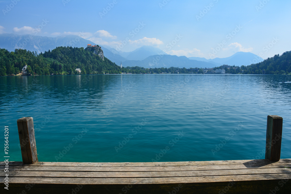 Cloudy summer day by the lake Bled in Slovenia with its clear turquoise water and famous castle and church