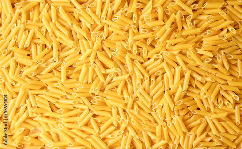 Pasta penne background. Raw pasta close-up. Italian Pasta background