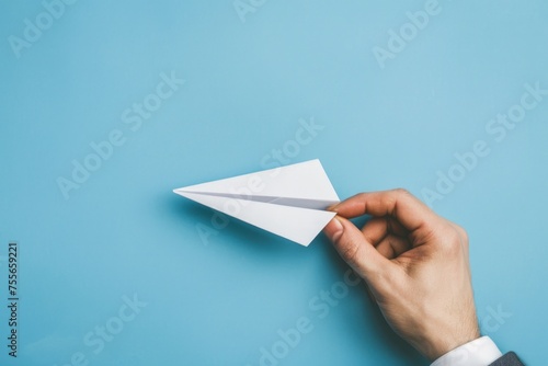 Businessman hand with paper plane, concept of business, innovation and creativity.