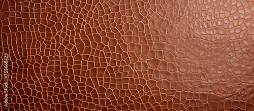 This close-up view showcases the intricate details and rich texture of brown leather. The image captures the smooth and grainy surface, revealing the quality and durability of the material.